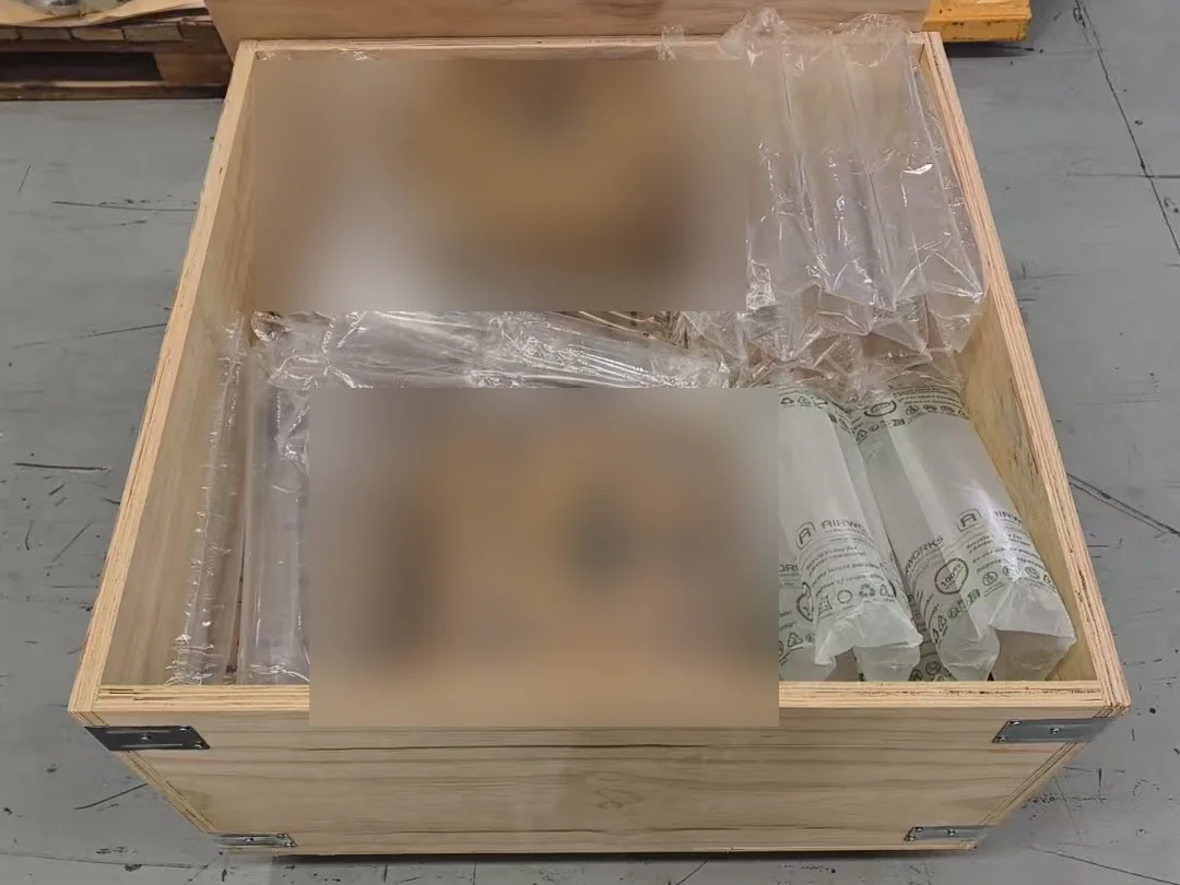 Wooden export crate with air cushion protection during industrial packing control